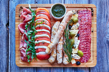 A italian wine plate sitting on top of a wooden cutting board