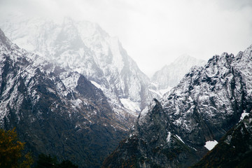 Snowy mountains with severe rocky peaks in Dombay, Caucasus, Karachay-Cherkessia, Russia.