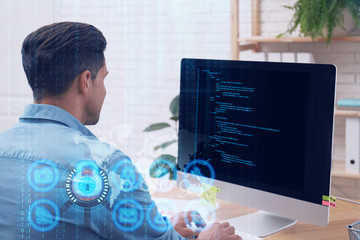 Professional programmer working with computer in office