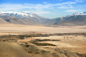 Traveling in the mountains. Altai Mountains, Russia. Wonderful mountain land with forest and valley.