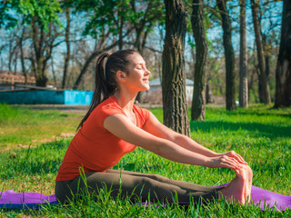 young woman doing yoga exercise