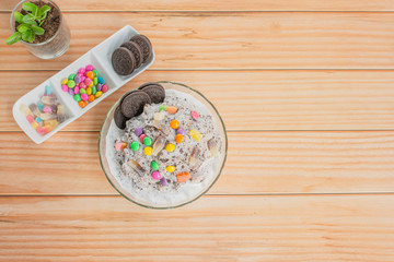 Chocolate patbingsu brownies or shaved ice (Top view) on the table, wooden background.