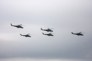 Naklejka na ściany i meble Combat helicopters fly to the May 9 parade