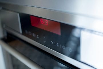 Oven control panel in the kitchen.