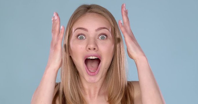 Wow. Close up portrait young woman beautiful girl with long blond hair looking excited
