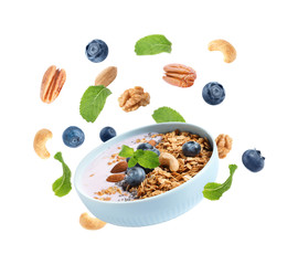 Delicious yogurt with blueberries, nuts and oatmeal on white background