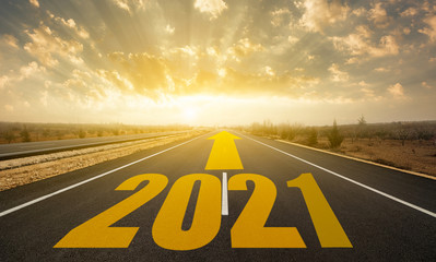The word 2021 written on highway road. Concept for new year 2021