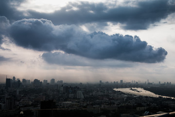 Giant clouds cover over the city and river