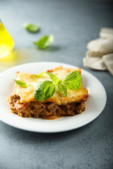 Traditional homemade lasagna with fresh basil