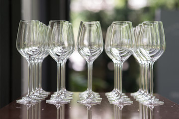 Empty wine glasses arranged in row