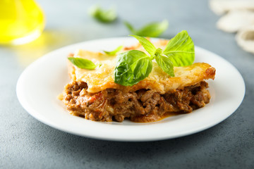Traditional homemade lasagna with fresh basil