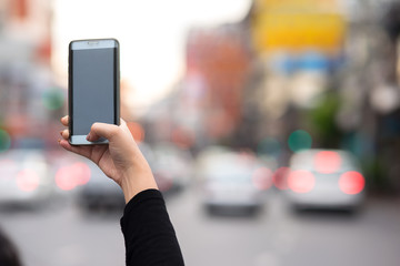 Girl shooting a picture with smartphone on sightseeing