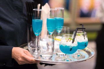 Waitress tray blue beverage service