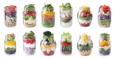 Set of different jars with healthy salads on white background