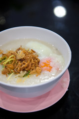 egg congee on dark background