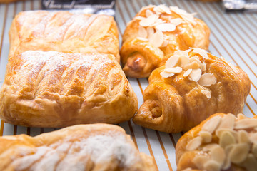 almond croissant and chicken pie in display