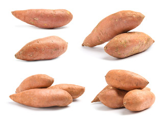 Fototapeta na wymiar Set of whole ripe sweet potatoes on white background