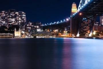 Fototapeta na wymiar Sydney Harbour Bridge long night exposure showing the vibrant colours of the lights on the water