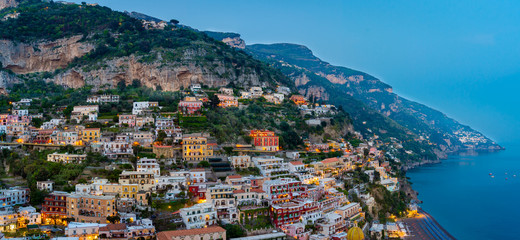 Naklejka premium Sunset view of the town of Positano at Amalfi Coast, Italy.