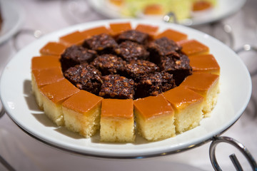 Walnut brownie stack, closeup chocolate and vanila cake  in plate