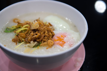 egg congee on dark background