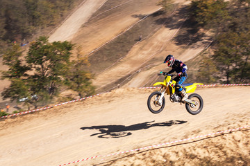 The motorcyclist is landing. Motocross. Sports. In the background draw.. A pleasant blur.