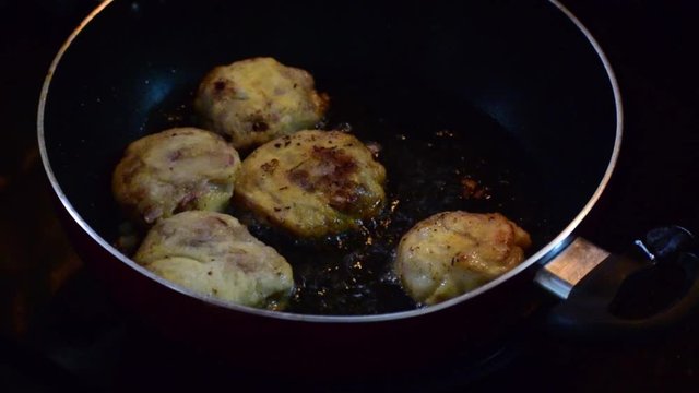 frying pan with meat.making of homemade cutlet like snap .indian kitchen home kitchen .fry food.dnak.