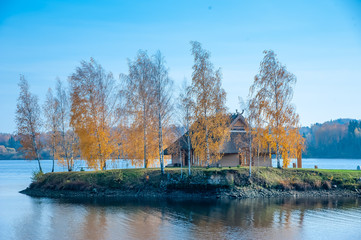 autumn landscape with lake and trees and sweet home view