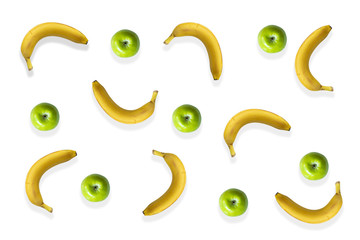 Green apples and bananas isolated on a white background. Top view.