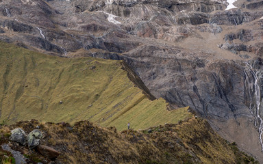 Person standing on a mountain ridge