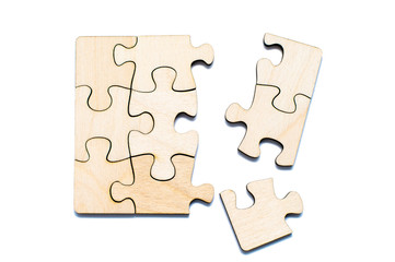 Connect empty wooden puzzles on a white background. Top view.