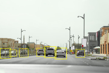 City road with scanner frames on cars outdoors, view from automobile. Machine learning