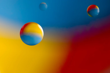 Water droplets on oil abstract