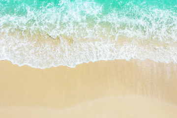 Fototapeta na wymiar sea waves on the beach with top view in summer 
