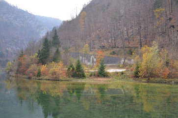 Beautiful lake with mirror reflection of autumn scenery at Slovenia.