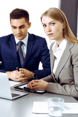 Fototapeta premium Business people using laptop pc while discussing project in office. Successful meeting and negotiation concepts