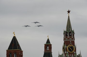 A group of turboprop strategic bombers Tu-95MS fly over Red Square in an air parade dedicated to...
