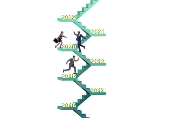 Businessman climbing stairs on yearly basis