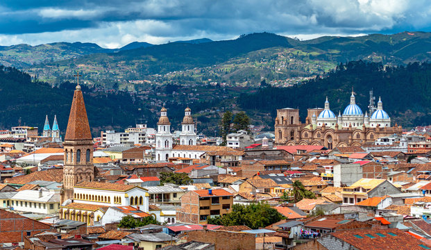 View of the city of Cuenca, with it's many churches, cathedrals and houses, in the middle of the Ecuadorian Andes, on a sunny afternoon, Ecuador, South America.