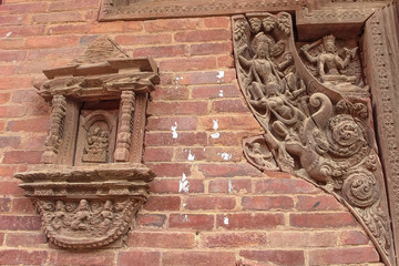 Carved wooden decorations of one of hinduism temples on Kathmandu Durbar Square in Kathmandu city, Nepal. Religious architecture theme.