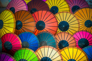 Beautiful colorful paper umbrellas displayed on Luang Prabang's very popular morning street market 