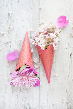 Bouquet - flower ice cream. Pink flowers in an ice cone