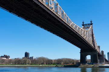 The Queensboro Bridge over the East River with a view of Long Island City Queens New York