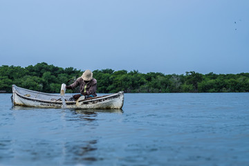 Fisherman on boat on the sea in Colombia