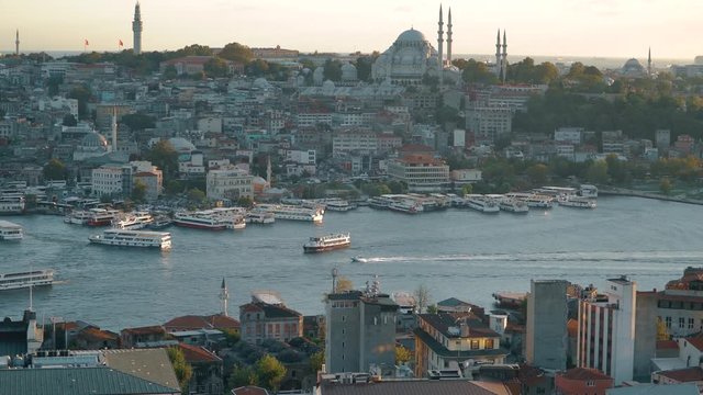 ISTANBUL, TURKEY, May 23rd 2018: The boat is sailing in the Golden Horn Bay Istanbul. Galata bridge. Sunset 4k video