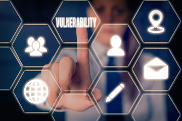 Conceptual hand writing showing Vulnerability. Concept meaning State of being exposed to the possibility of being attacked