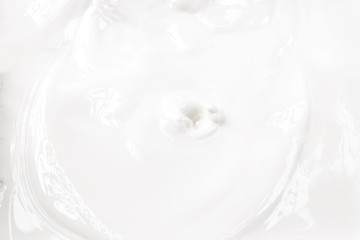 Fototapeta na wymiar close up of white splashing and swirling delicious milk