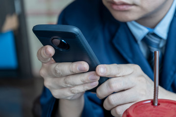 Businessman sitting to check the phone