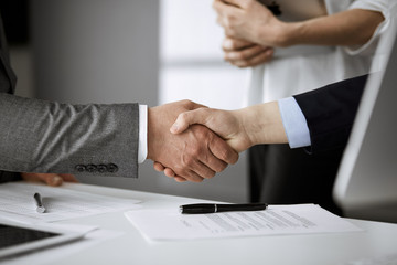 Business people shaking hands finishing contract signing, close-up. Business communication concept. Handshake and marketing