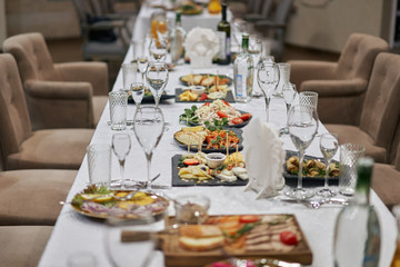 Reception in a trendy restaurant, set table.